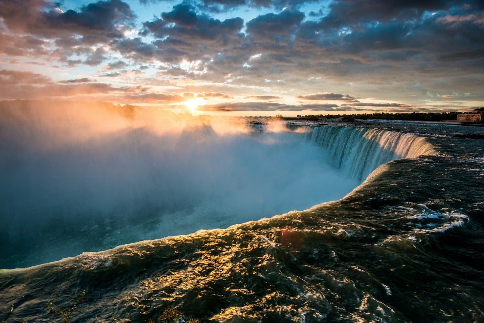 The Horseshoe Falls at first light, mist rising off the water